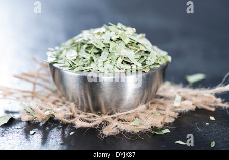 Portion of dried Tarragon in a small bowl Stock Photo