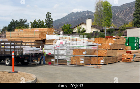 Piles of Lumber at a Construction Site Stock Photo