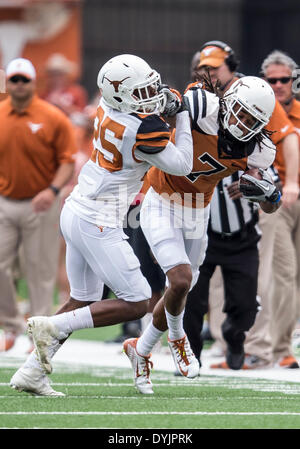 Austin, Texas, USA. 19th Apr, 2014. April 19, 2104: Texas Longhorns wide receiver Marcus Johnson (7) avoids the tackle by Texas Longhorns cornerback Antwuan Davis (25) after a reception during the annual Texas Football Orange-White Scrimmage at Darrell K Royal-Texas Memorial Stadium in Austin, TX. © csm/Alamy Live News Stock Photo