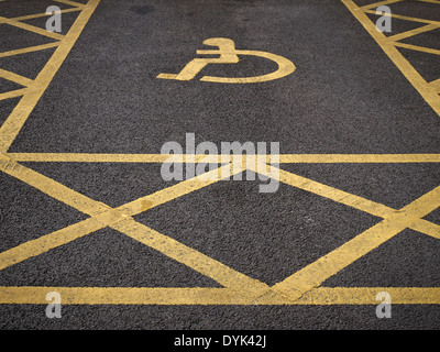 Disabled parking space sign painted on tarmac UK Stock Photo