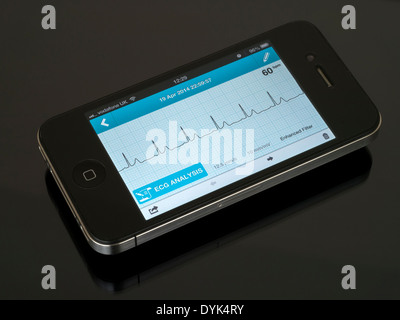 Portable ECG EKG Heart Monitor App running on iPhone 4 showing normal sinus heart rhythm trace. Stock Photo