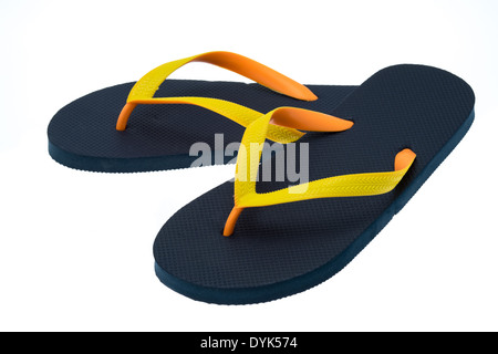 Black thong type flip-flops with orange and yellow straps - studio shot with a white background Stock Photo