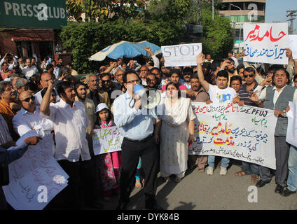 LAHORE,PAKISTAN-APRIL 20: Pakistani Journalists chant slogans against dastardly attack on Private T.V Channel senior anchorperson Hamid Mir during protest demonstration arranged by Federal Union of Journalists at Lahore on April 20, 2014. (Photo by Rana Sajid Hussain/Pacific Press) Stock Photo