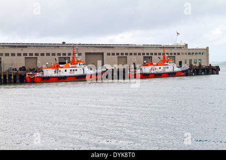 Two pilot boats docked at a pier in San Francisco Bay. Stock Photo