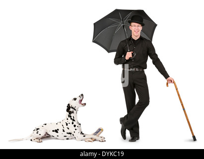 junger Mann mit Melone, Regenschirm und Gehstock, young man with bowler hat, umbrella and walking stick, Mann mit Dalmatiner; Sc Stock Photo