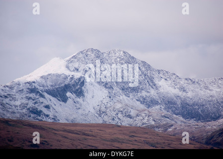 Snow covered mount Snowdon on a cloudy winter morning, Snowdonia Circle Wales, UK Stock Photo