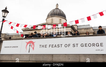 London, UK. 21st Apr, 2014. People participating to the Feast of Saint George, organised by the Mayor of London Boris Johnson, in Trafalgar Square, London, UK on Monday, 21 April, 2014. Inspired by St George's Day’s 13th century origins as a national day of feasting, the event is celebrated with a banqueting area seating 250 people between Trafalgar Square’s iconic fountains and an English farmer’s market, food stalls, children's activities and live music courtesy of the Music Medley bandstand with young musicians and singers from GIGS, the Mayor’s busking competition. © Cecilia Colussi/Alamy