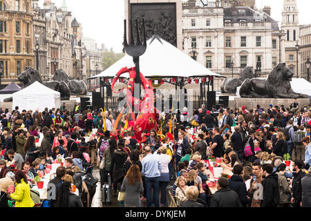 London, UK. 21st Apr, 2014. The Feast of Saint George, organised by the Mayor of London Boris Johnson, in Trafalgar Square, London, UK on Monday, 21 April, 2014. Inspired by St George's Day’s 13th century origins as a national day of feasting, the event is celebrated with a banqueting area seating 250 people between Trafalgar Square’s iconic fountains and an English farmer’s market, food stalls, children's activities and live music courtesy of the Music Medley bandstand with young musicians and singers from GIGS, the Mayor’s busking competition. Credit:  Cecilia Colussi/Alamy Live News Stock Photo