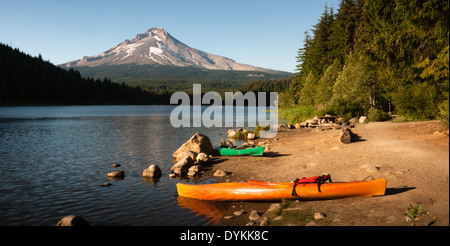 Kayaks beached on the shore of an Oregon Lake Stock Photo