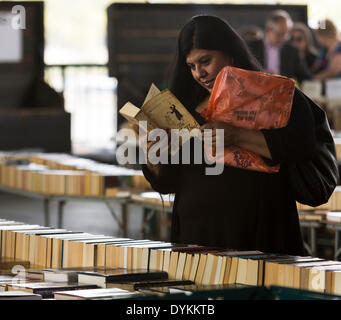 London, UK. 21st Apr, 2014. Woman reading a book at Southbank book market, London, UK on Monday, 21 April, 2014 Credit:  Cecilia Colussi/Alamy Live News Stock Photo