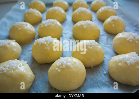Raw sweet rolls, before going into oven on tray, baking, Finland, Europe Stock Photo