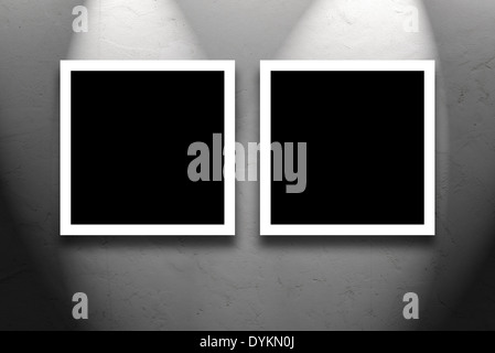 Two Square Paintings hanging on the art gallery white wall. Stock Photo