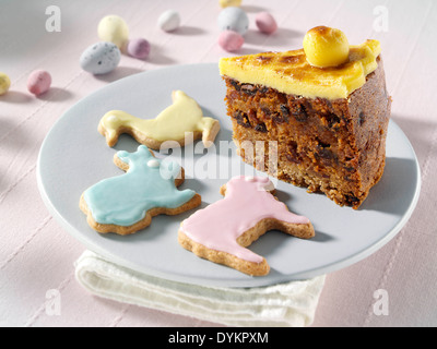 Simnel cake slice with animal biscuits Stock Photo