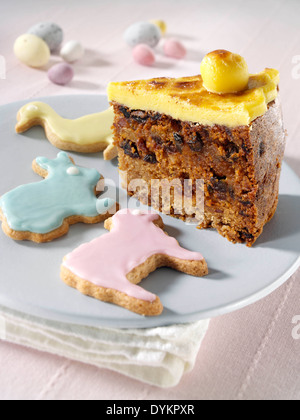 Simnel cake slice with animal biscuits Stock Photo