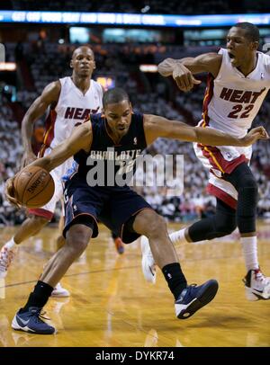 Miami, Florida, USA. 20th Apr, 2014. Miami Heat guard Ray Allen (34) and Miami Heat forward James Jones (22) defend Charlotte Bobcats guard Gary Neal (12) at AmericanAirlines Arena in Miami, Florida on April 20, 2014. © Allen Eyestone/The Palm Beach Post/ZUMAPRESS.com/Alamy Live News Stock Photo