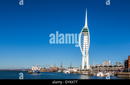 Spinnaker Tower at the popular Gunwharf Quay retail shopping outlet, Portsmouth Harbour on the Solent, south coast, Hampshire, UK with blue sky on a clear sunny day Stock Photo