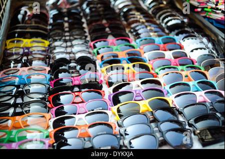Cheap Sunglasses for sale by a street corner vendor. Stock Photo