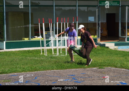 One day with parachutist in airfield. Preparation for parachute packaging. Stock Photo