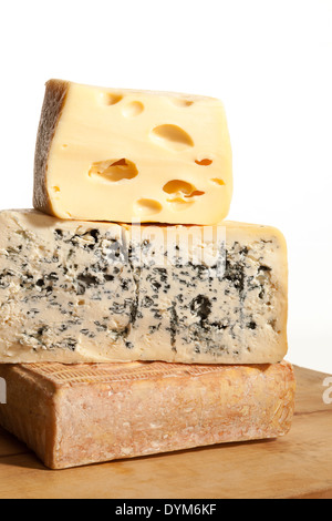 Three huge various cheese block on wooden background. Culinary cheese background. Stock Photo