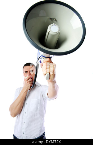 Portrait of a man roaring loudly into megaphone over white background Stock Photo