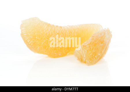 Two peeled pomelo pieces isolated on white background. Tasty fresh fruit eating concept. Stock Photo
