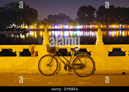 Thousands of locals and visitors of Beijing enjoy night life at Chou-Chai park on the bank of Hou Hai lake  situated right in the center of Chinese capital, on Sunday, April 20th, 2014.  (CTK Photo/Rene Fluger) Stock Photo