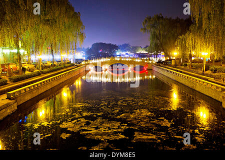 Thousands of locals and visitors of Beijing enjoy night life at Chou-Chai park on the bank of Hou Hai lake  situated right in the center of Chinese capital, on Sunday, April 20th, 2014.  (CTK Photo/Rene Fluger) Stock Photo