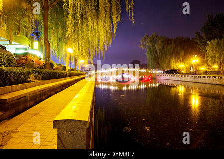 Thousands of locals and visitors of Beijing enjoy night life at Chou-Chai park on the bank of Hou Hai lake  situated right in the center of Chinese capital, on Sunday, April 20th, 2014.  (CTK Photo/Rene Fluger) Stock Photo