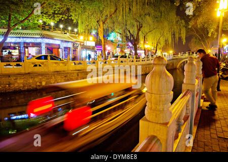 Thousands of locals and visitors of Beijing enjoy night life at Chou-Chai park on the bank of Hou Hai lake  situated right in the center of Chinese capital, on Sunday, April 20th, 2014.  (CTK Photo/Rene Fluger) Stock Photo