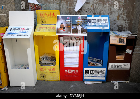 London, England, UK. Free Chinese newspapers in Gerrard Street, Chinatown Stock Photo