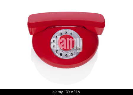 Red retro phone isolated on white background. Retro design from the sixties. Stock Photo
