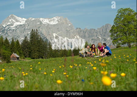 Hikers sitting on the mountain pasture, Gesäuse region, Styria, Austria Stock Photo