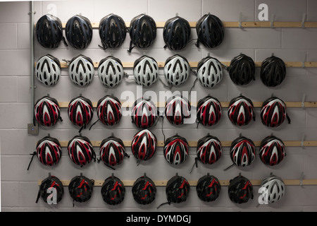 Stock of helmets which are loaned out to customers at Commonwealth Games competition venue, the Sir Chris Hoy Velodrome Stock Photo
