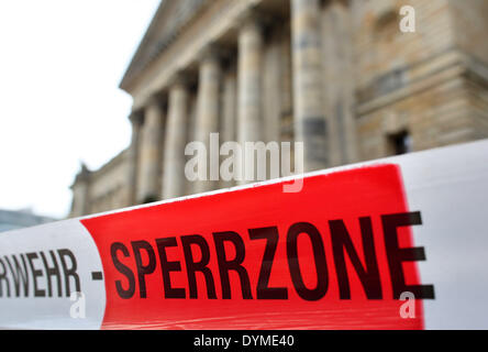 Red-white barrier tape of the fire brigade hangs on front of the Federal Administrative Court of Germany (BVerwG) in Leipzig, Germany, 22 April 2014. A suspicious white powder has triggered a fire brigade operation. The powder was found when a letter was opened in the court's mail room. No one was injured and the building was not evacuated. Photo: JAN WOITAS/DPA Stock Photo