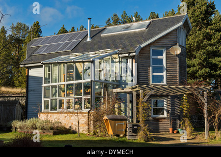 GLASS FRONTED HOUSE IN THE FINDHORN FOUNDATION ECOVILLAGE MORAY SCOTLAND Stock Photo