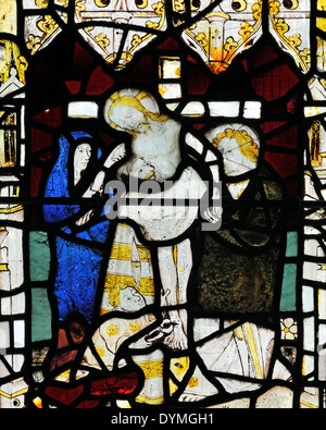 14th century stained glass window depicting the removal of Christ from the cross, Church of All Saints Pavement, York, England Stock Photo