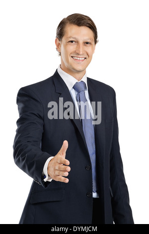 Photo of an attractive businessman in his late twenties extending his hand out. Stock Photo