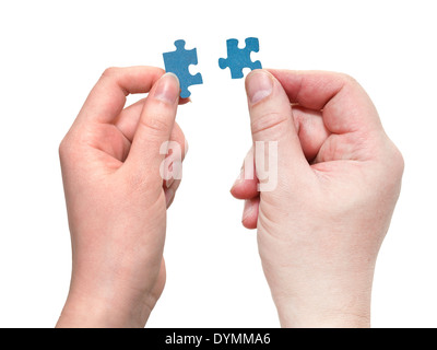 pair of male and female hands with little puzzle pieces isolated on white background Stock Photo