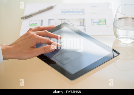 Close-up Of Hands Architect Woman Using Tablet Pc in office Stock Photo
