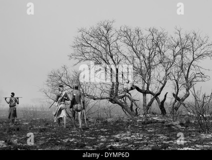 Bushmen In The Bush After A Fire, Tsumkwe, Namibia Stock Photo