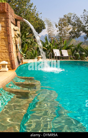 Vertical view of a luxurious landscaped pool at a high end boutique hotel. Stock Photo
