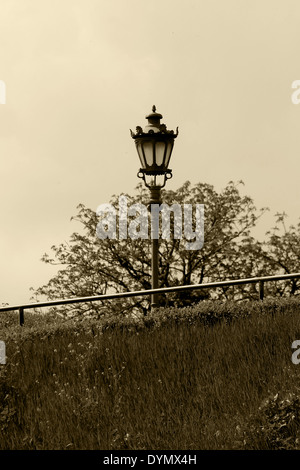 Old street lamp in old fashion sepia style. Stock Photo