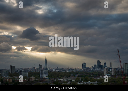 The Shard building in London at sunset with sunrays breaking through dark clouds, UK. Stock Photo
