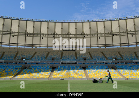 A groundsman prepares the pitch at Maracana stadium in Rio de Janeiro, Brazil, staging the soccer FIFA World Cup Final 2014. Stock Photo