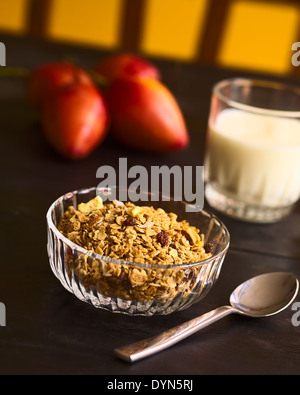 Breakfast cereal out of oat bran flakes, sesame, honey, almonds and dried fruits Stock Photo