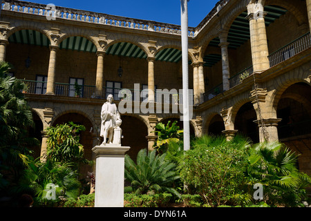 Interior courtyard of the old Havana Cuba Governors palace museum with statue of Columbus Stock Photo