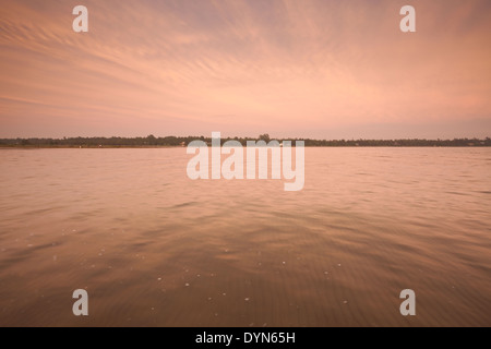 A very hazy sunset produces unique colours over Lake Huron at Singing Sands, Bruce Peninsula National Park, Ontario, Canada. Stock Photo