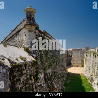 Fortified walls and dry moat of Morro Castle fortress guarding Havana Bay Cuba Stock Photo