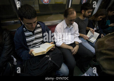 Buenos Aires, Argentina. 22nd Apr, 2014. Passengers read on their trip in the subway, in the city of Buenos Aires, capital of Argentina, on April 22, 2014. The World Book Day is commemorated on Wednesday, aiming to promote reading, and boost the editorial industry and the protection of the intellectual property by copyrights. © Martin Zabala/Xinhua/Alamy Live News Stock Photo