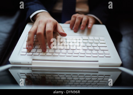 Male hands typing on laptop Stock Photo